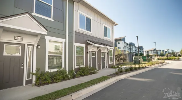 a city street lined with tall buildings
