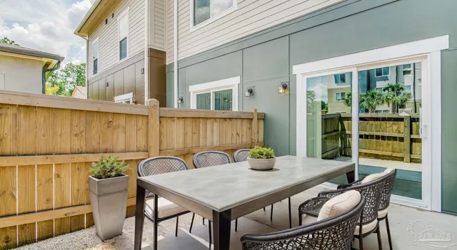 a view of a table and chairs in patio of the house