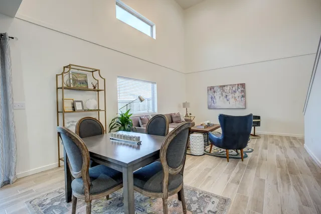 a kitchen with stainless steel appliances kitchen island granite countertop a stove a sink and a refrigerator