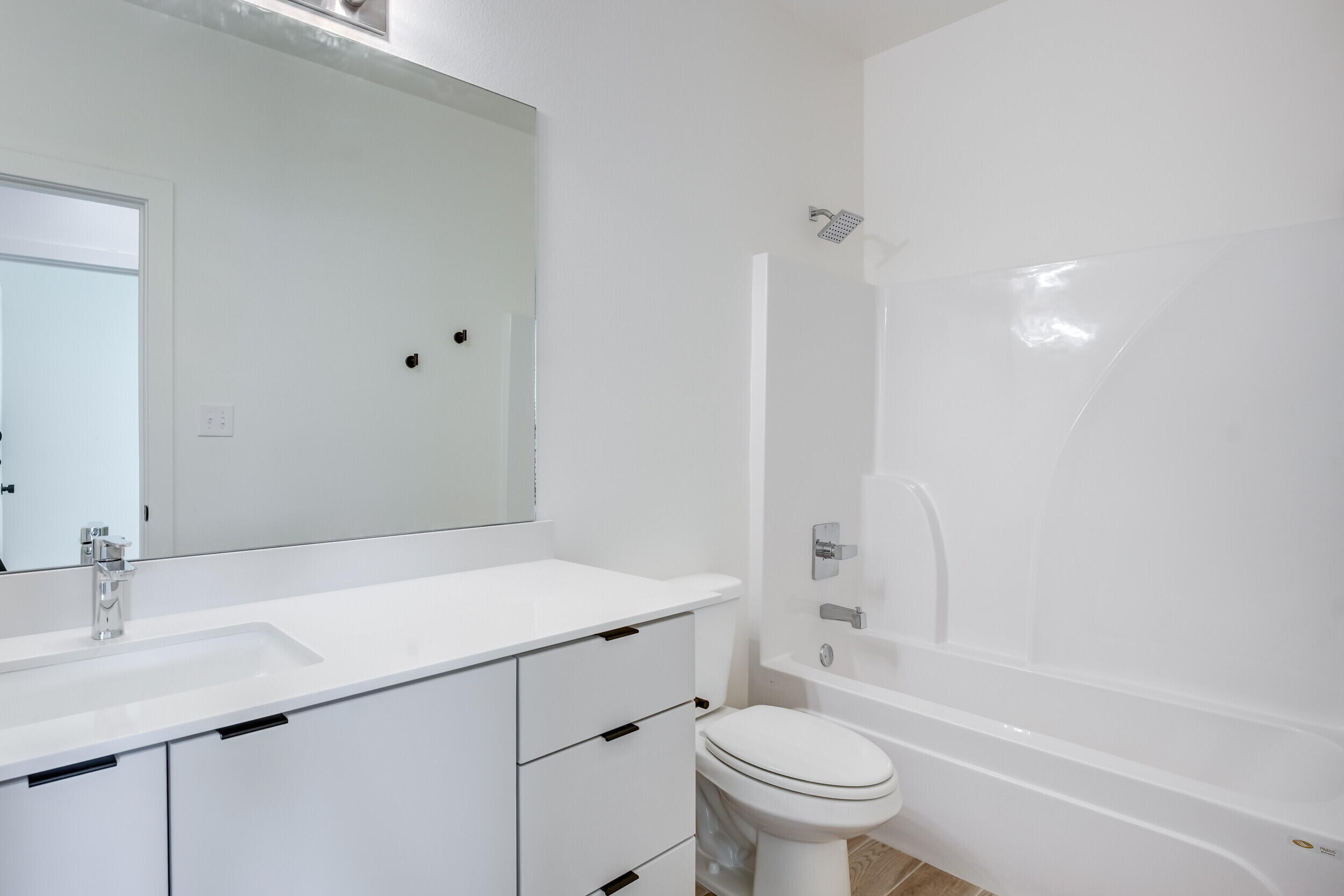 310 Homestead Avenue, Unit 16 Lubbock, TX 79416 - Photo 19 of 29 a bathroom with a sink toilet vanity and tub