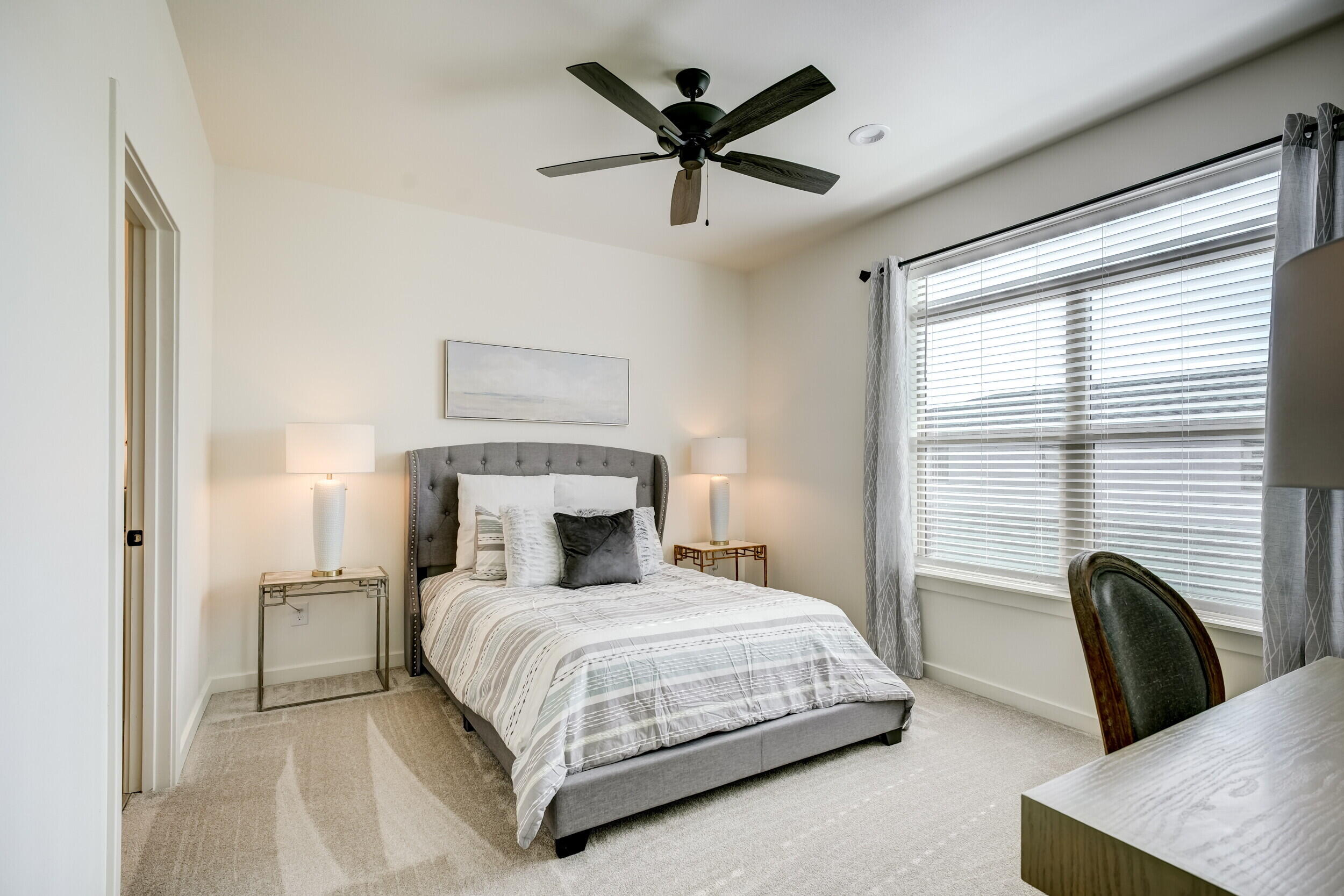 310 Homestead Avenue, Unit 16 Lubbock, TX 79416 - Photo 20 of 29 a bedroom with a bed and window