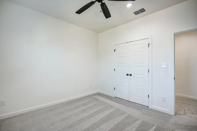 a view of a backyard with pathway