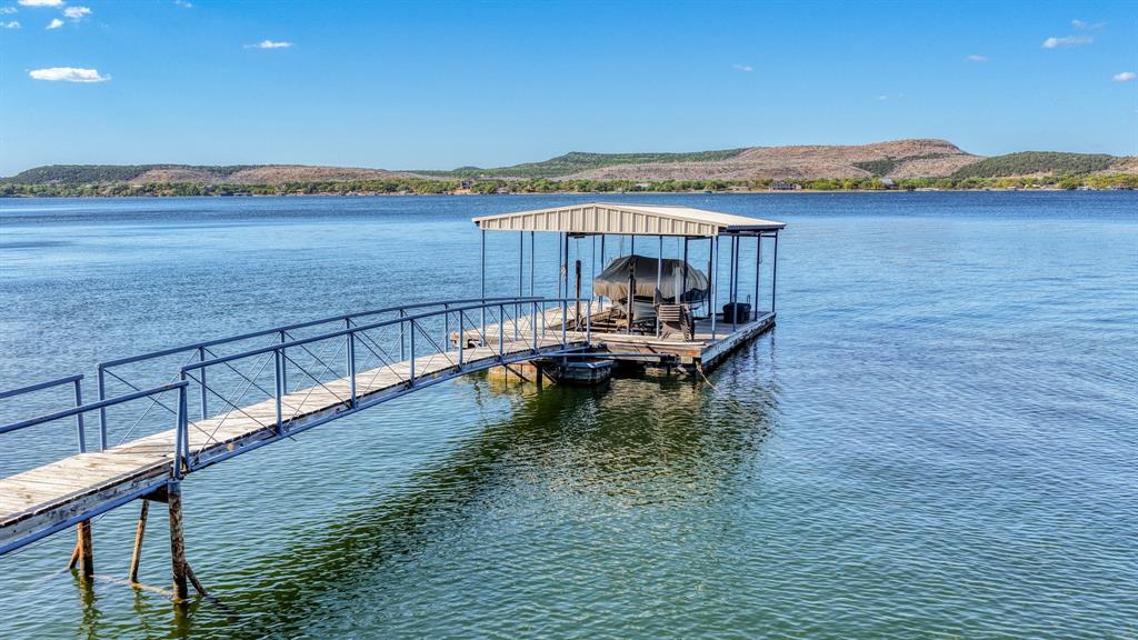 2181 Trail Ridge Road, Unit 2 Graford, TX 76449 - Photo 29 of 30 Dock area featuring a water and mountain view and boat lift