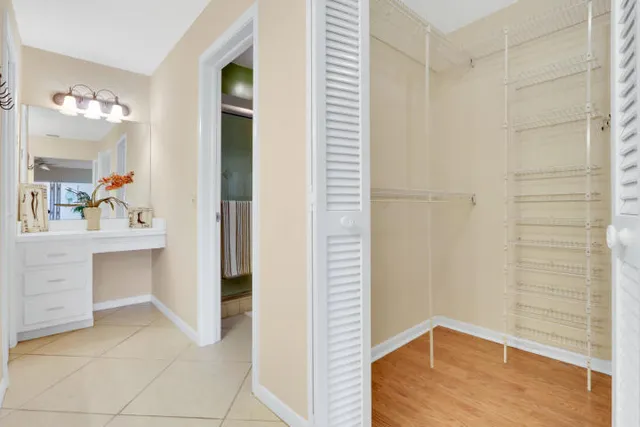 a view of bathroom with a sink and mirror