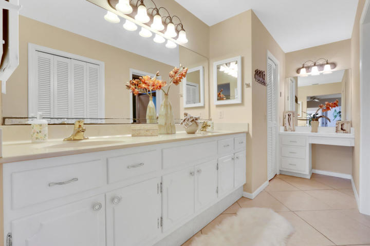 434 French Royale Circle Atlantis, FL 33462 - Photo 12 of 17 a bathroom with a sink double vanity