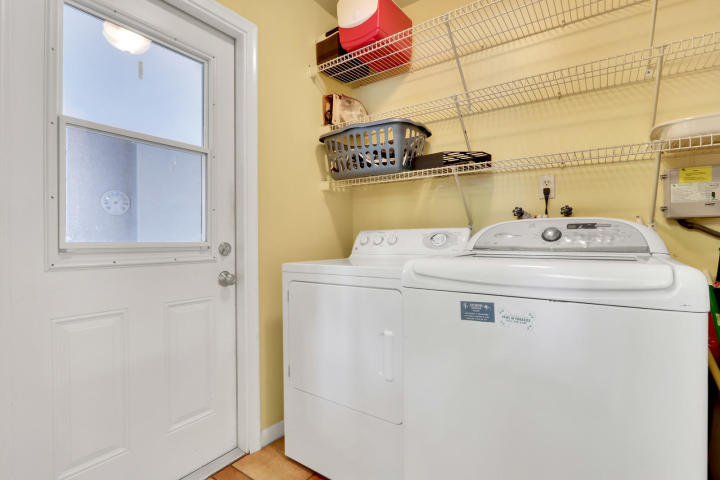 434 French Royale Circle Atlantis, FL 33462 - Photo 15 of 17 a utility room with a washer and dryer