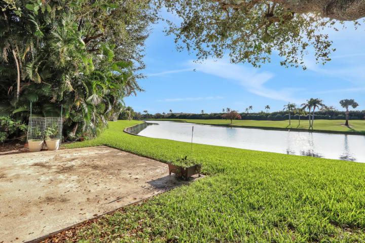 434 French Royale Circle Atlantis, FL 33462 - Photo 17 of 17 a view of a lake with houses in the back