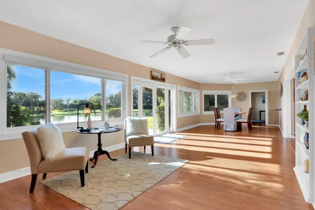 a view of a living room and balcony with furniture
