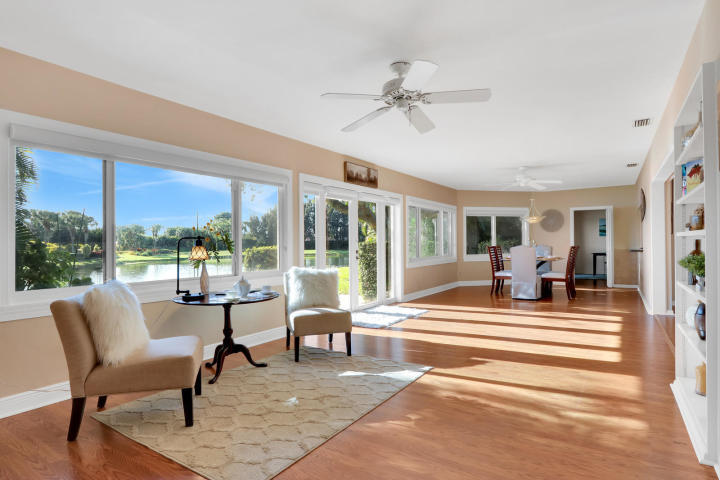 434 French Royale Circle Atlantis, FL 33462 - Photo 5 of 17 a view of a living room and balcony with furniture
