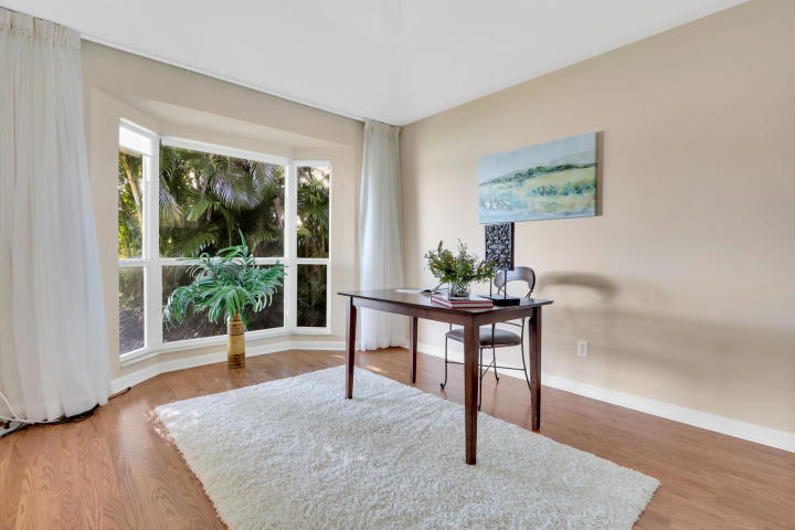 434 French Royale Circle Atlantis, FL 33462 - Photo 9 of 17 a view of a livingroom with furniture window and wooden floor