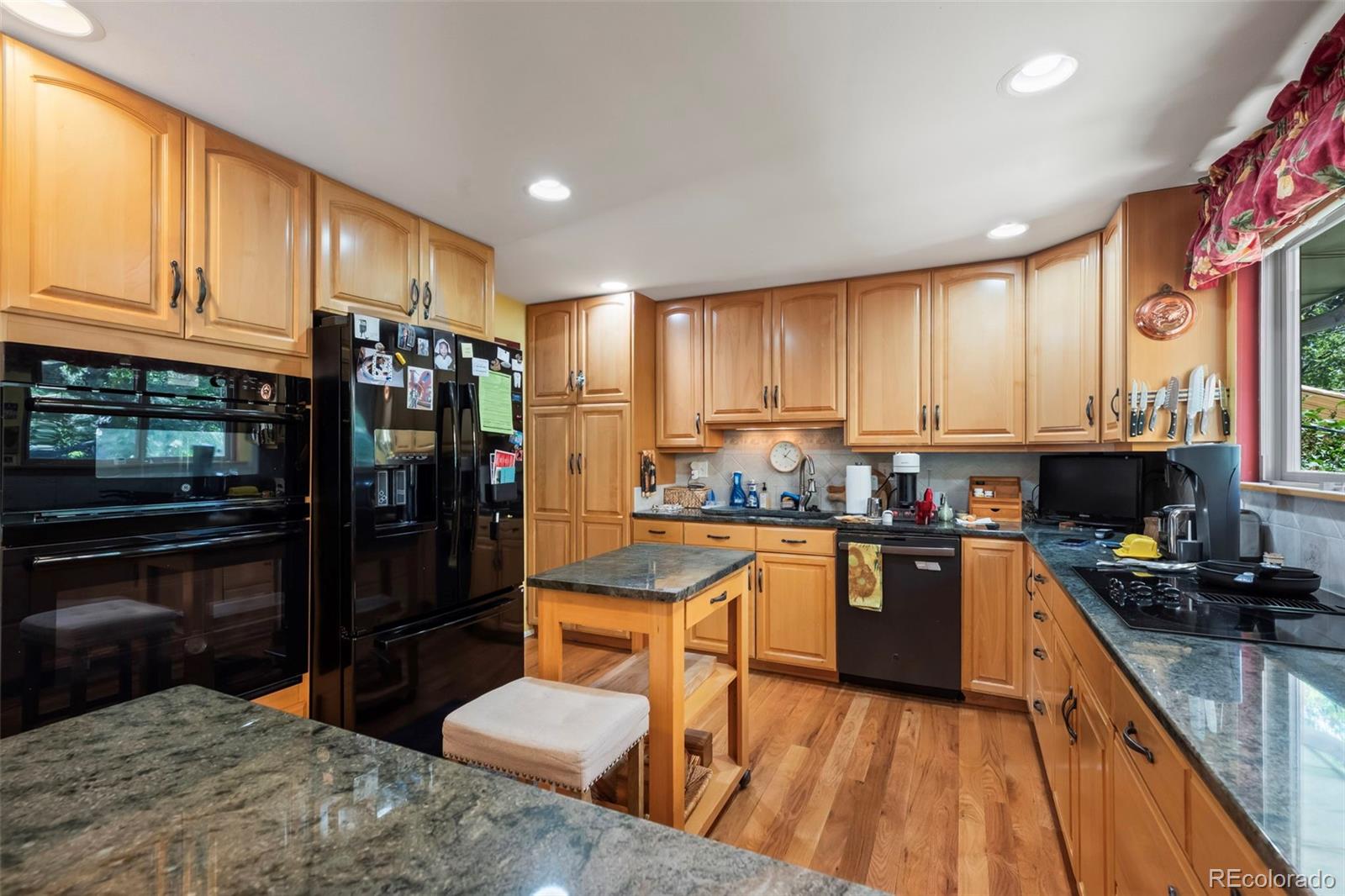 1560 Findlay Way Boulder, CO 80305 - Photo 11 of 40 a kitchen with stainless steel appliances granite countertop a refrigerator stove top oven and sink