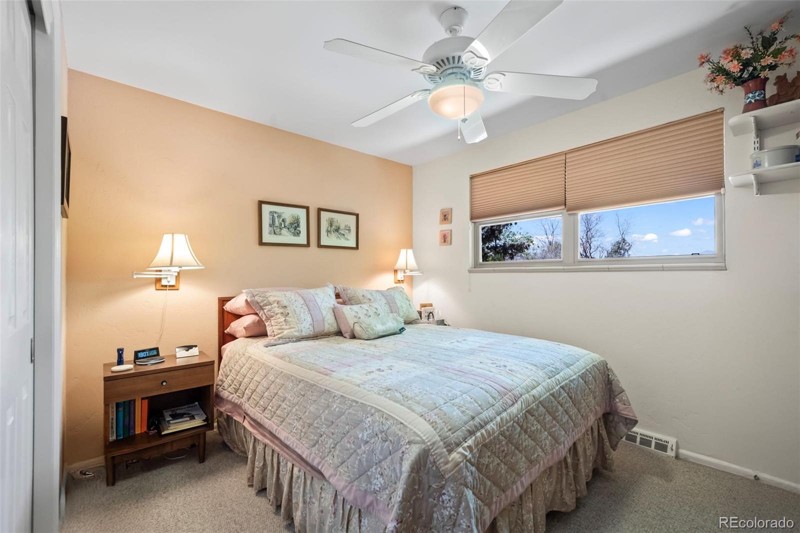 1560 Findlay Way Boulder, CO 80305 - Photo 12 of 40 a bedroom with a bed and a chandelier