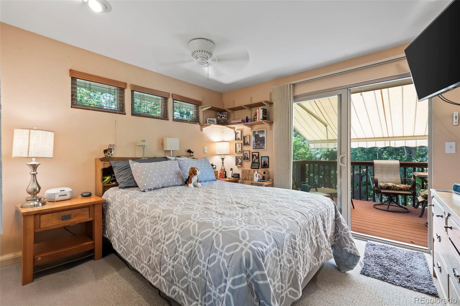 1560 Findlay Way Boulder, CO 80305 - Photo 14 of 40 a bedroom with a large bed and a window