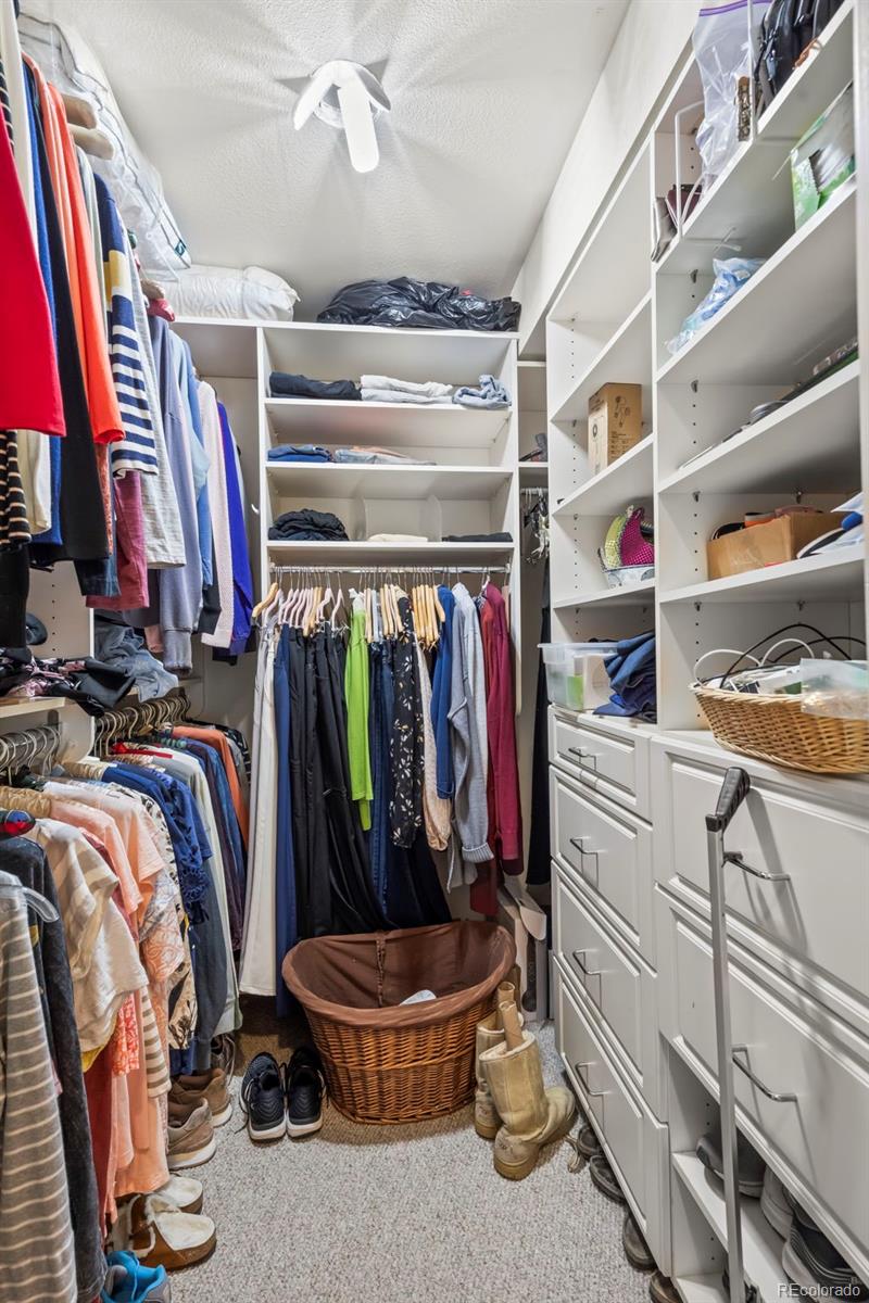 1560 Findlay Way Boulder, CO 80305 - Photo 17 of 40 a view of walk in closet with clothes and shoes
