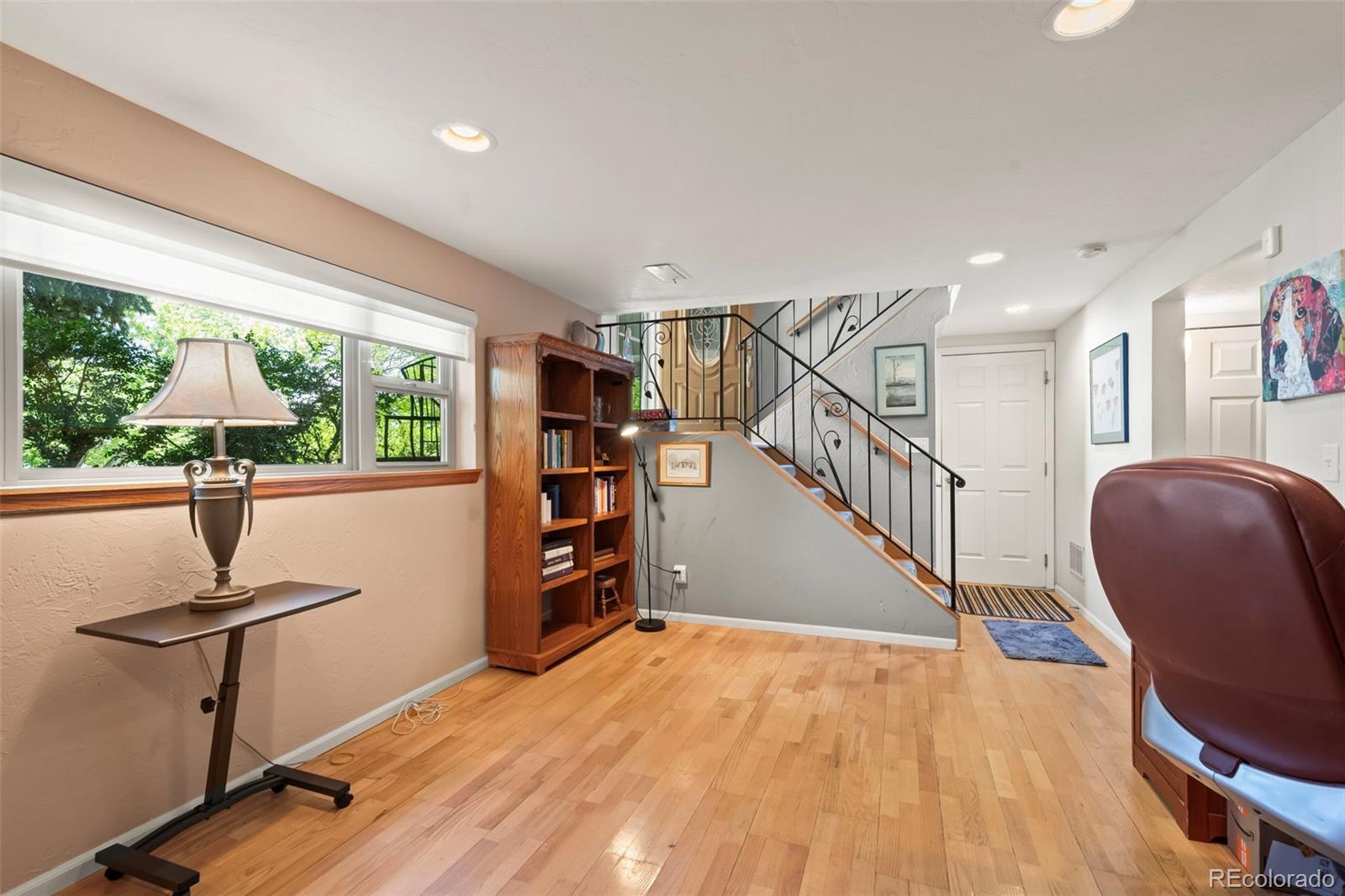 1560 Findlay Way Boulder, CO 80305 - Photo 22 of 40 a view of a livingroom with furniture staircase and a floor to ceiling window