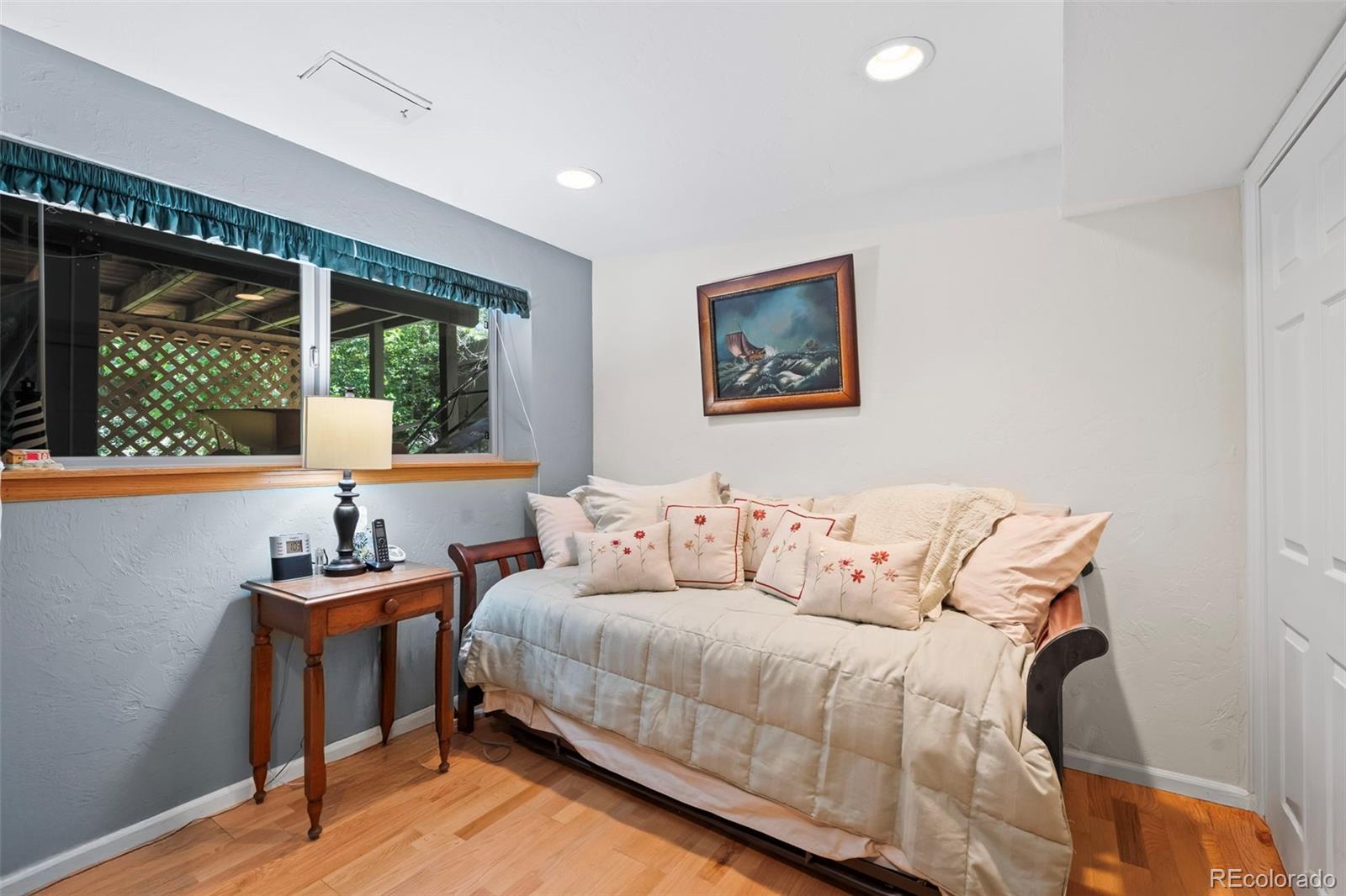 1560 Findlay Way Boulder, CO 80305 - Photo 25 of 40 a bedroom with a bed and a table