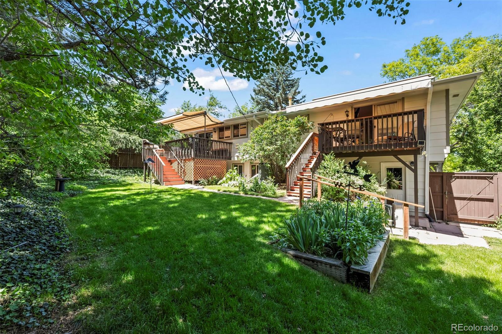 1560 Findlay Way Boulder, CO 80305 - Photo 32 of 40 a view of a house with a yard