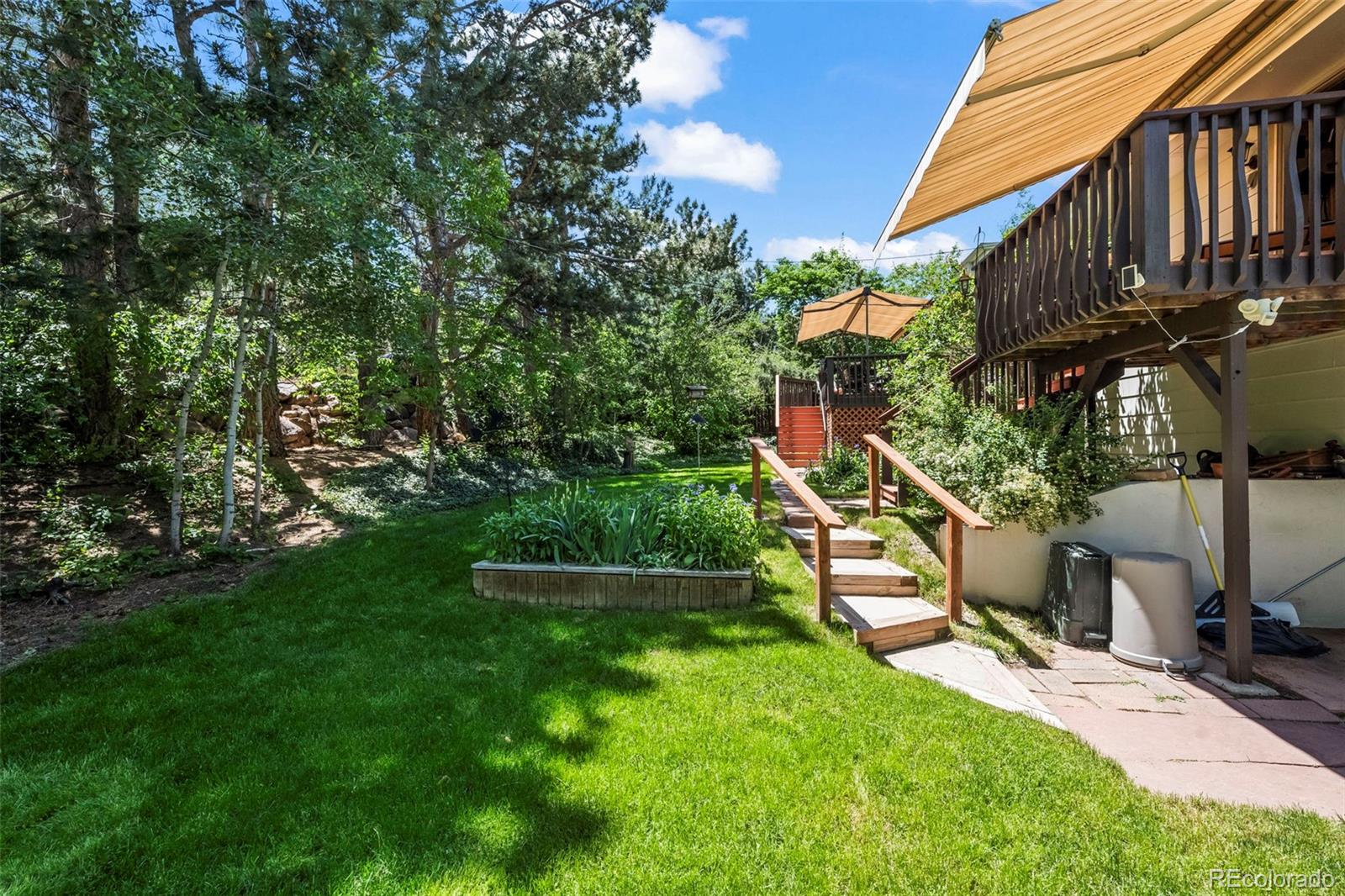 1560 Findlay Way Boulder, CO 80305 - Photo 33 of 40 a view of backyard with deck and garden