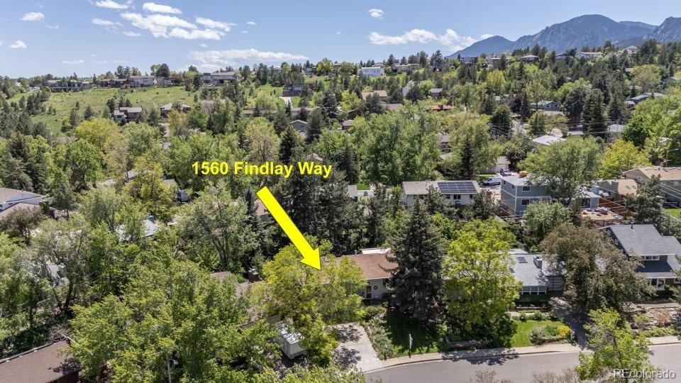 1560 Findlay Way Boulder, CO 80305 - Photo 38 of 40 a view of a house with a swimming pool and a yard