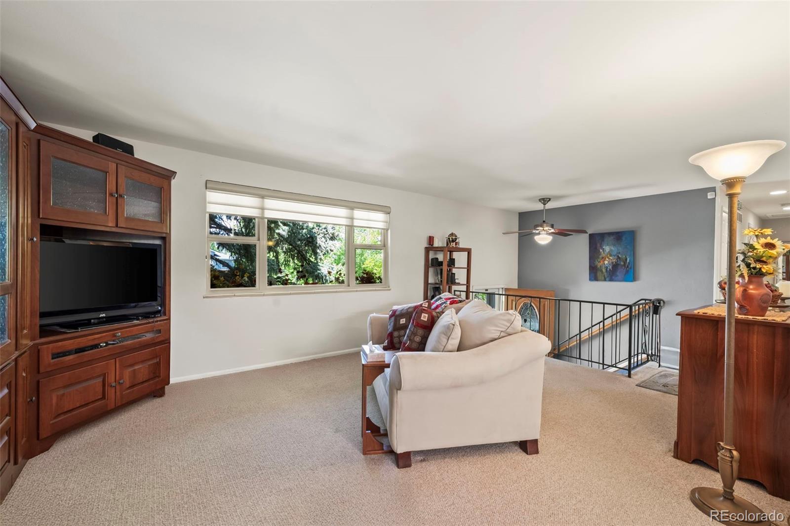 1560 Findlay Way Boulder, CO 80305 - Photo 4 of 40 a living room with furniture and a flat screen tv