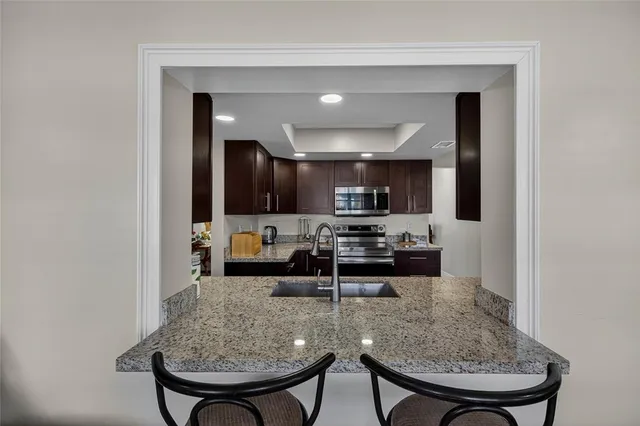 a kitchen with a table and chairs in it