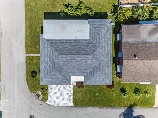 an aerial view of a house with a garden