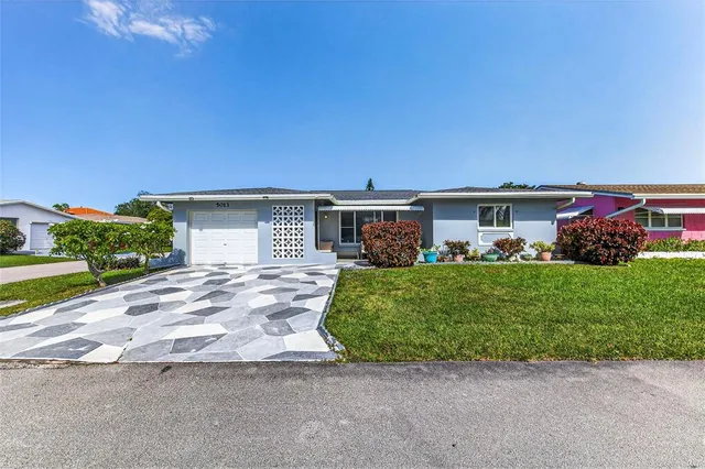 front view of a house with a big yard