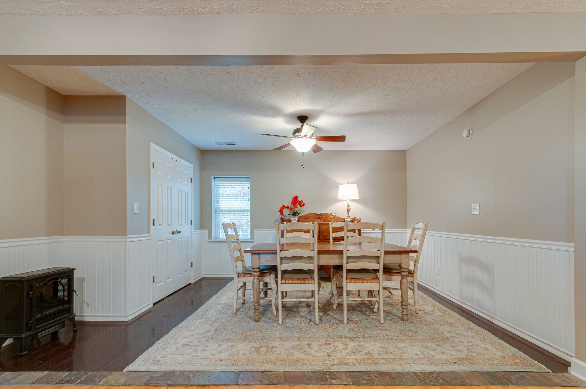 7264 Deer Ridge Road Fairview, TN 37062 - Photo 17 of 37 a dining room with furniture a rug and a chandelier