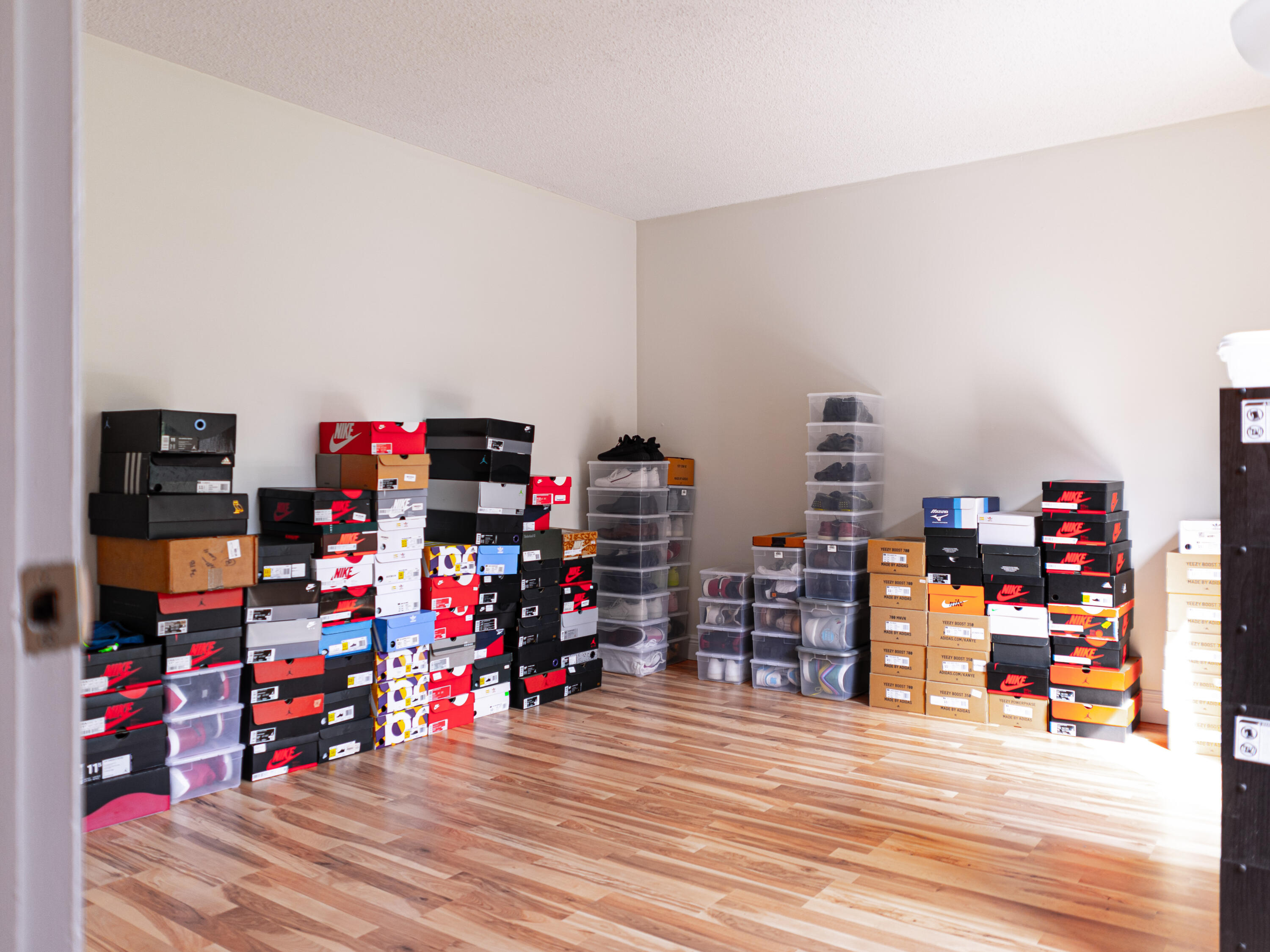 3118 Spanish Wells Drive, Unit 15B Delray Beach, FL 33445 - Photo 16 of 23 a view of a garage with toys and a wooden floor