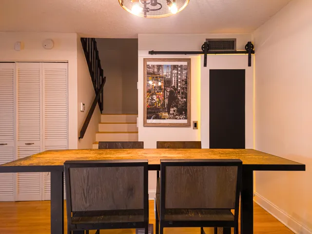 a view of balcony with furniture and a window