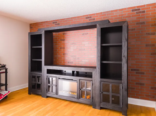 a kitchen with stainless steel appliances wooden cabinets and a stove top oven