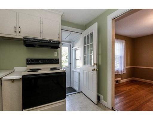 480 Plumtree Road Springfield, MA 01118 - Photo 3 of 28 a kitchen with stainless steel appliances granite countertop a stove and a refrigerator