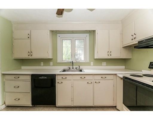 480 Plumtree Road Springfield, MA 01118 - Photo 4 of 28 a kitchen with a sink stove and cabinets