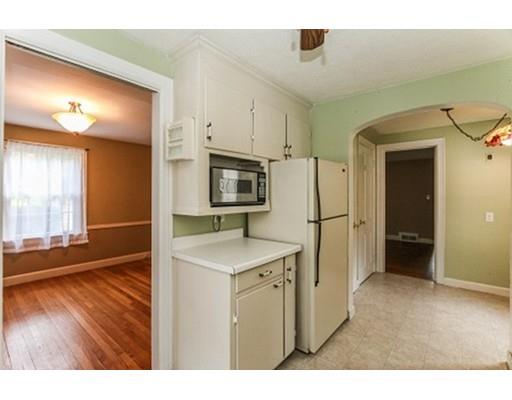 480 Plumtree Road Springfield, MA 01118 - Photo 6 of 28 a kitchen with cabinets and wooden floor