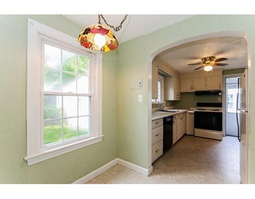 480 Plumtree Road Springfield, MA 01118 - Photo 7 of 28 a kitchen with granite countertop a stove and a refrigerator