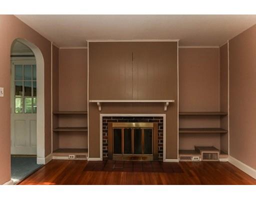 480 Plumtree Road Springfield, MA 01118 - Photo 9 of 28 a living room with furniture and a fireplace