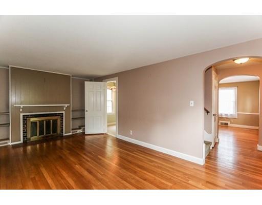 480 Plumtree Road Springfield, MA 01118 - Photo 10 of 28 a view of empty room with wooden floor and fireplace