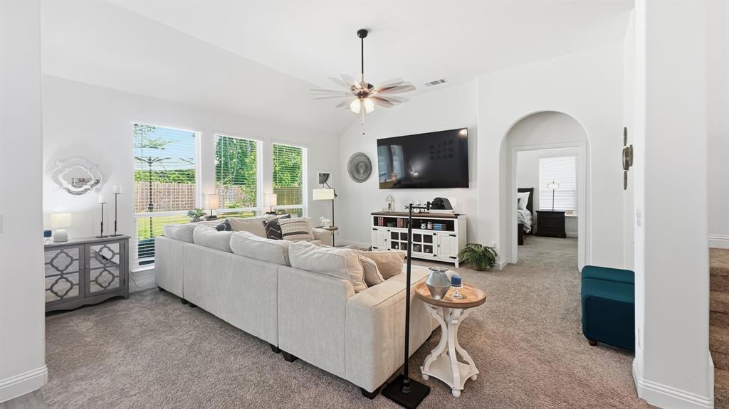 5216 Troupe Road McKinney, TX 75071 - Photo 14 of 40 Spacious living area featuring vaulted ceilings, recessed lighting, and expansive windows