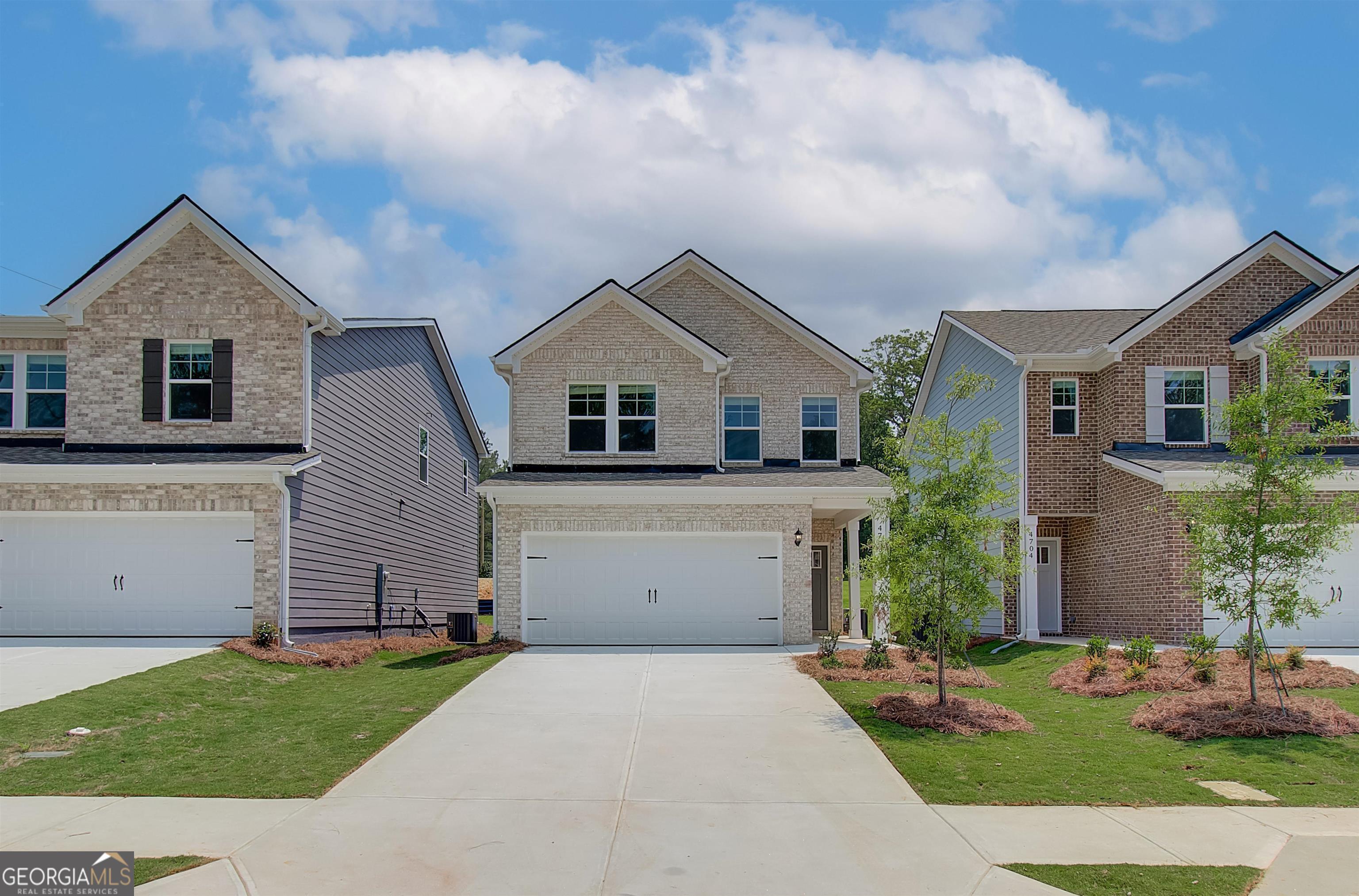 4709 Kyle Terrace South Fulton, GA 30349 - Photo 1 of 1 a front view of house with yard and green space