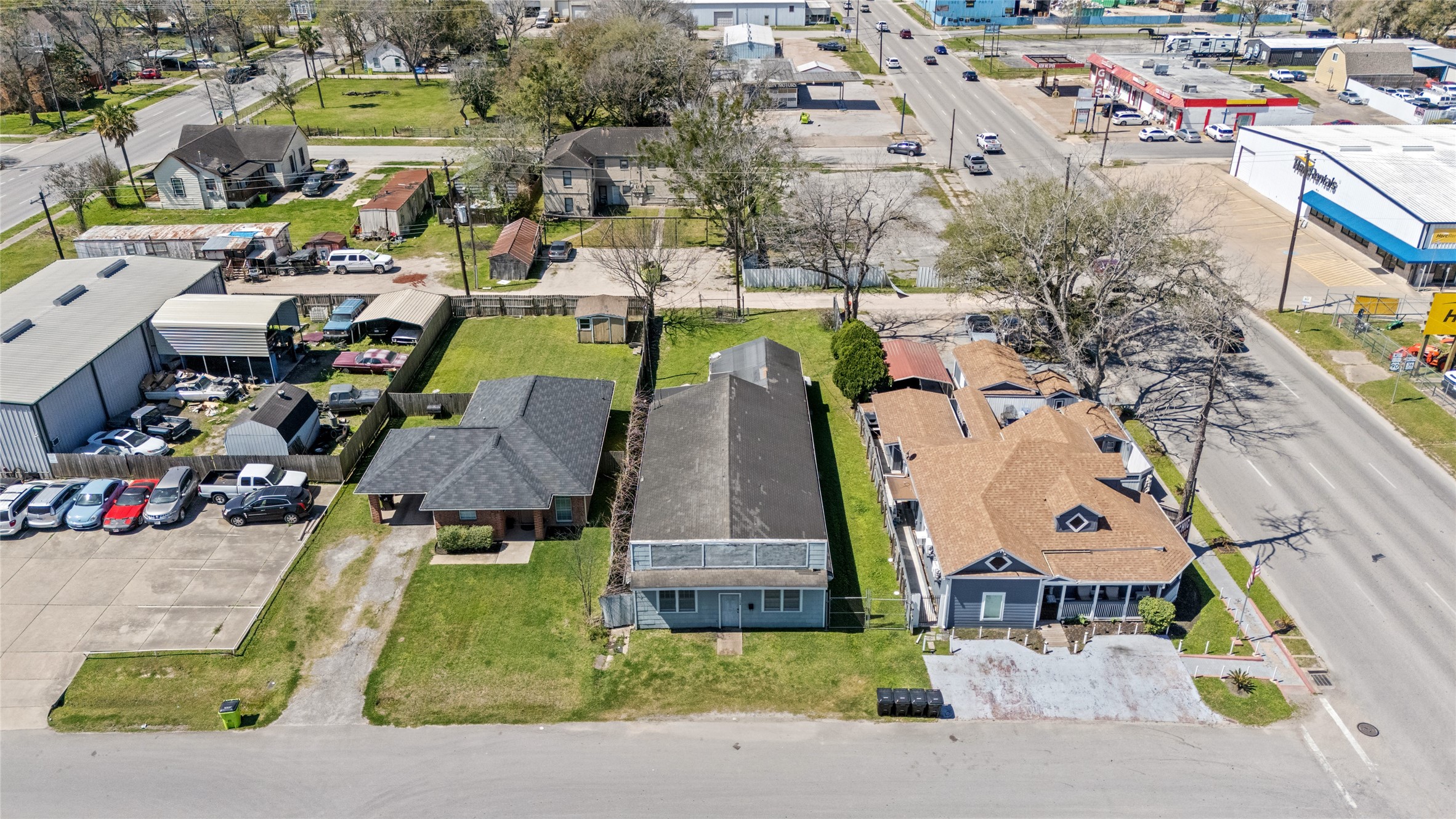 1004 Houston Street Rosenberg, TX 77471 - Photo 3 of 7 Front aerial view - Positioned in a high-traffic area, surrounded by retail, commercial, and residential properties. Existing structure is a tear down, offering prime redevelopment potential.