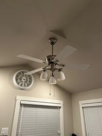 a bedroom with a bed and a shower curtain