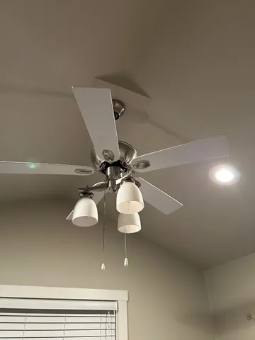 a kitchen with granite countertop a refrigerator and a sink