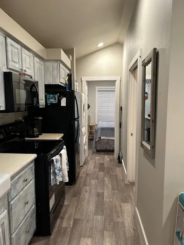 a workspace with furniture and a flat screen tv