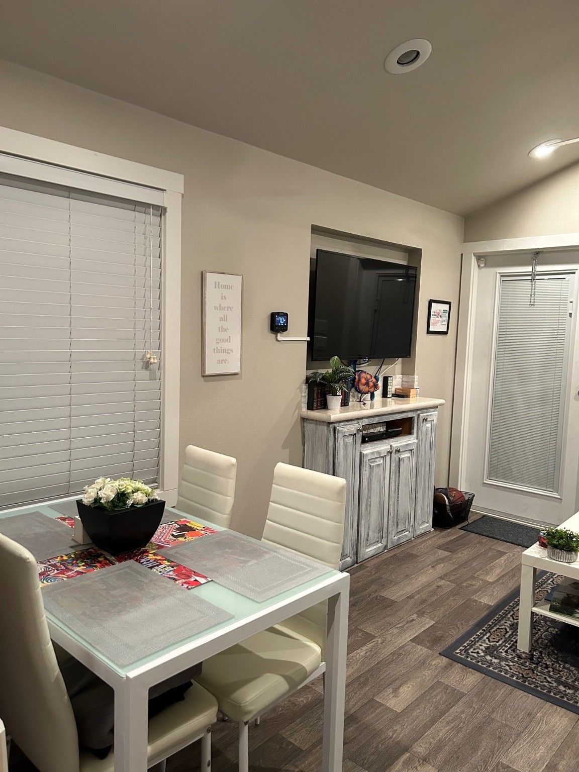 12922 Longstreet Road, Unit L10 Willis, TX 77318 - Photo 18 of 21 a workspace with furniture and a flat screen tv