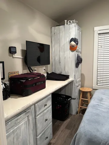 a kitchen with a sink and a stove top oven