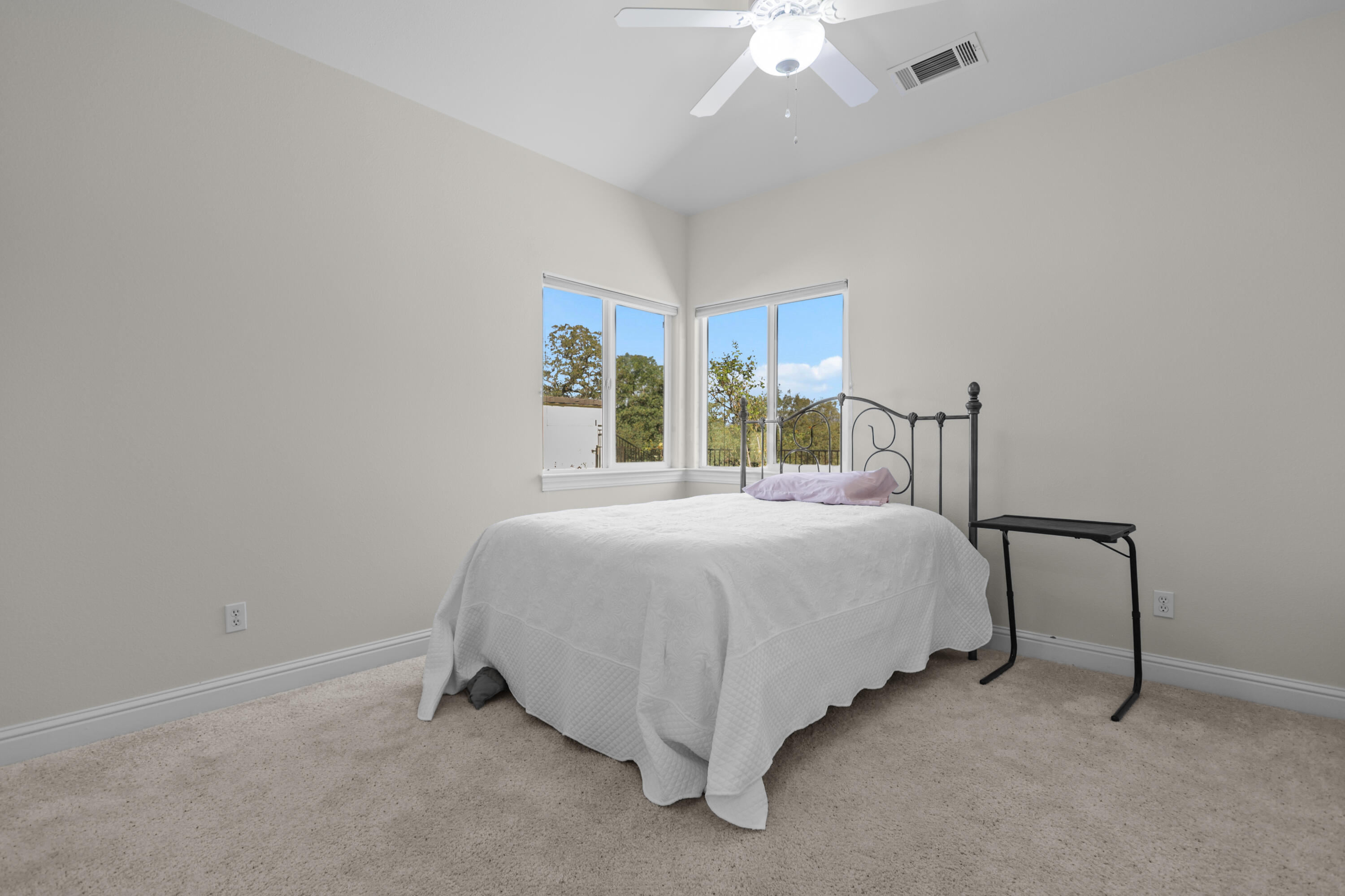 2110 Cadjew Street Redding, CA 96003 - Photo 49 of 62 a bedroom with a bed and window