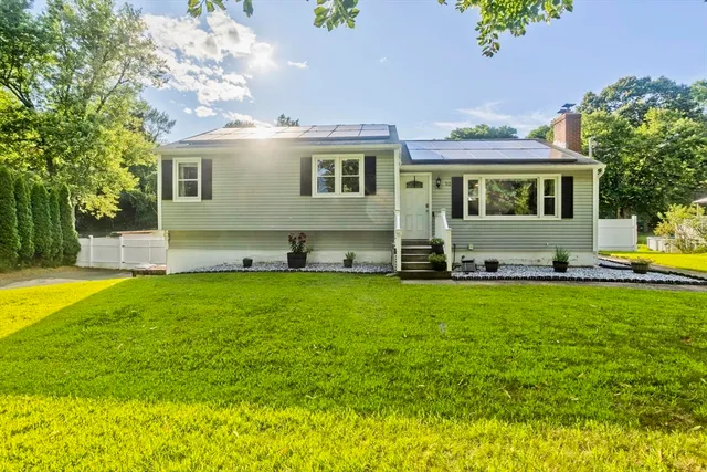 a front view of a house with garden