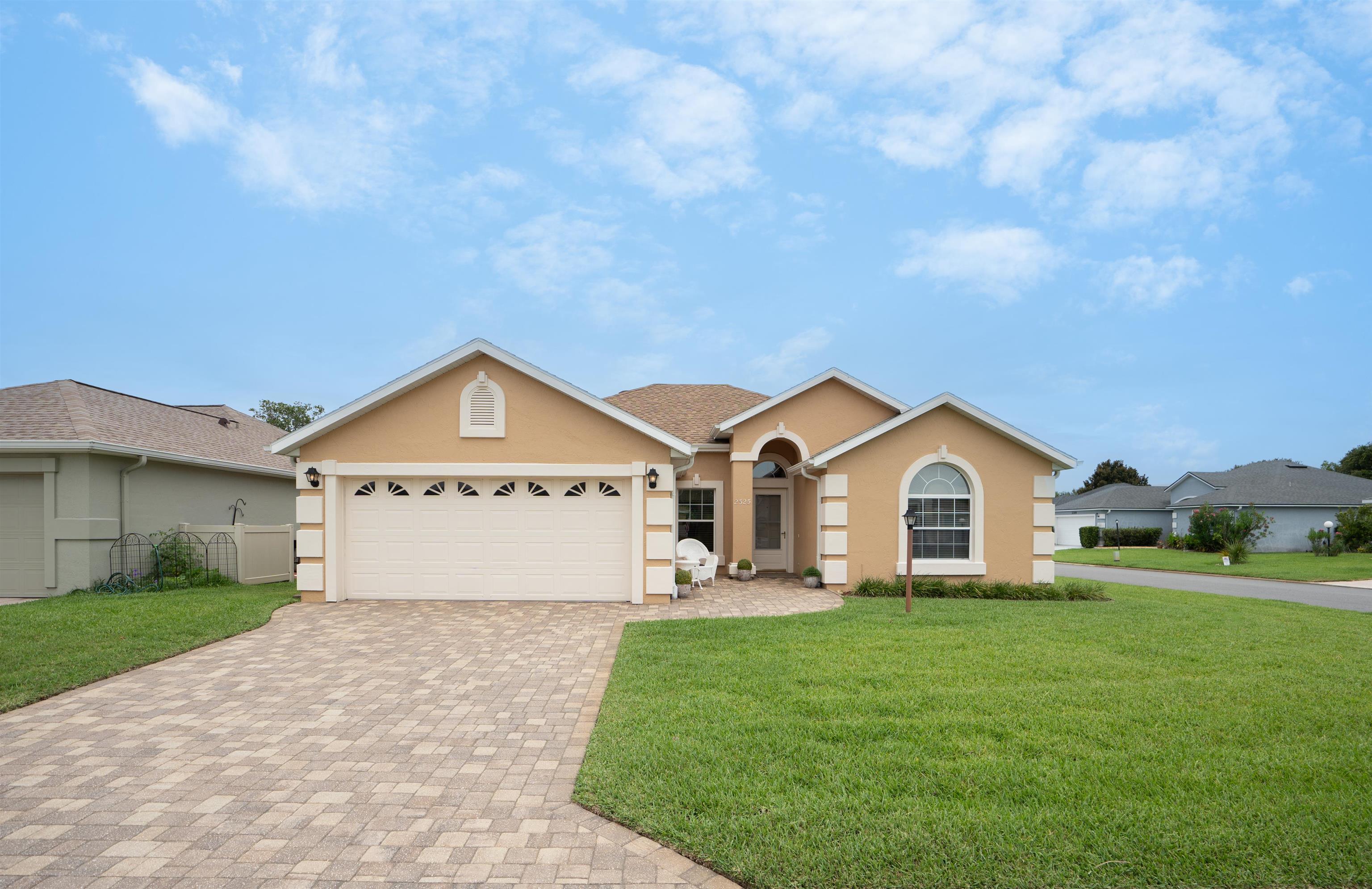 a view of front of house with a yard