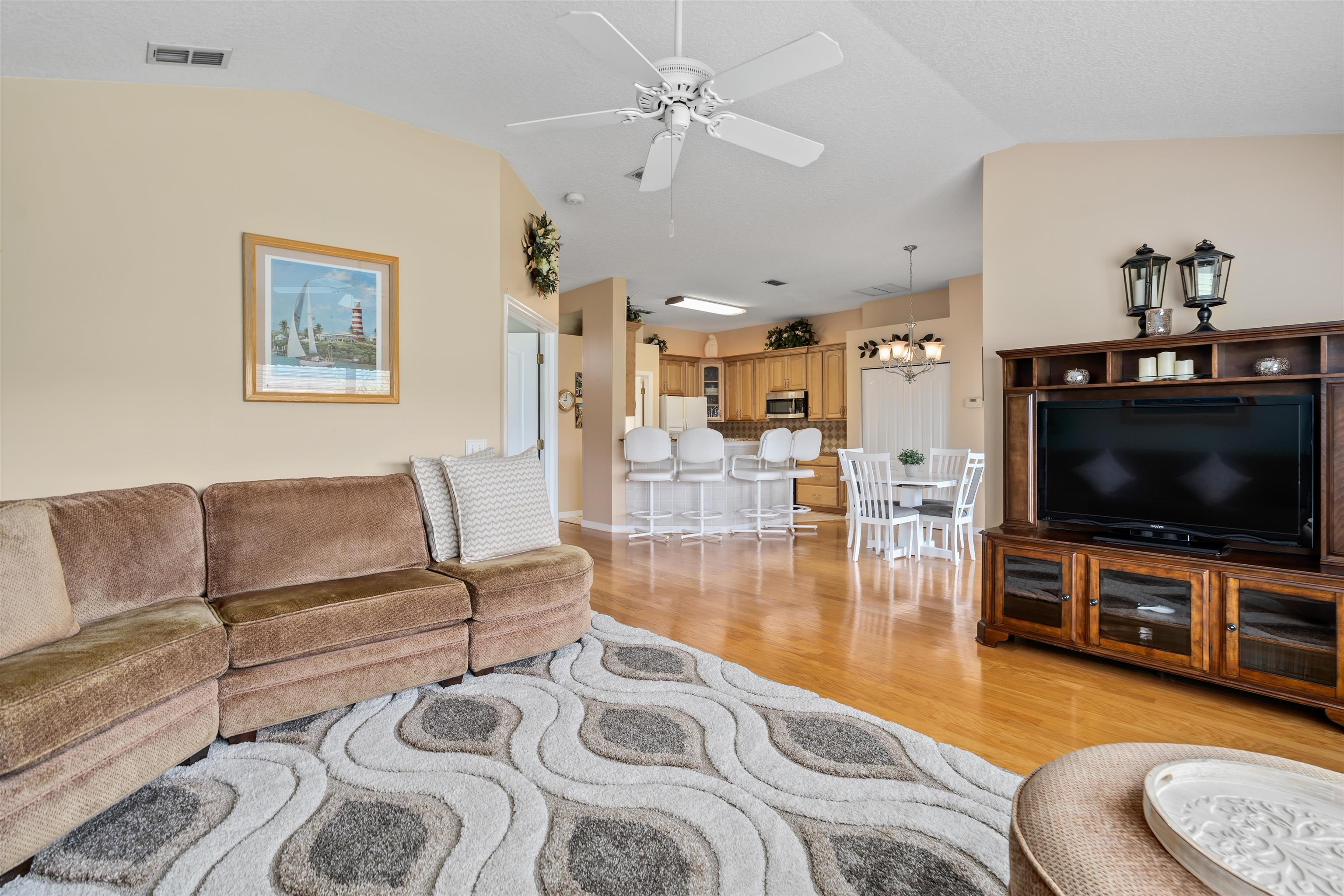 2325 Commodores Club Boulevard St. Augustine, FL 32080 - Photo 14 of 38 a living room with furniture and a flat screen tv