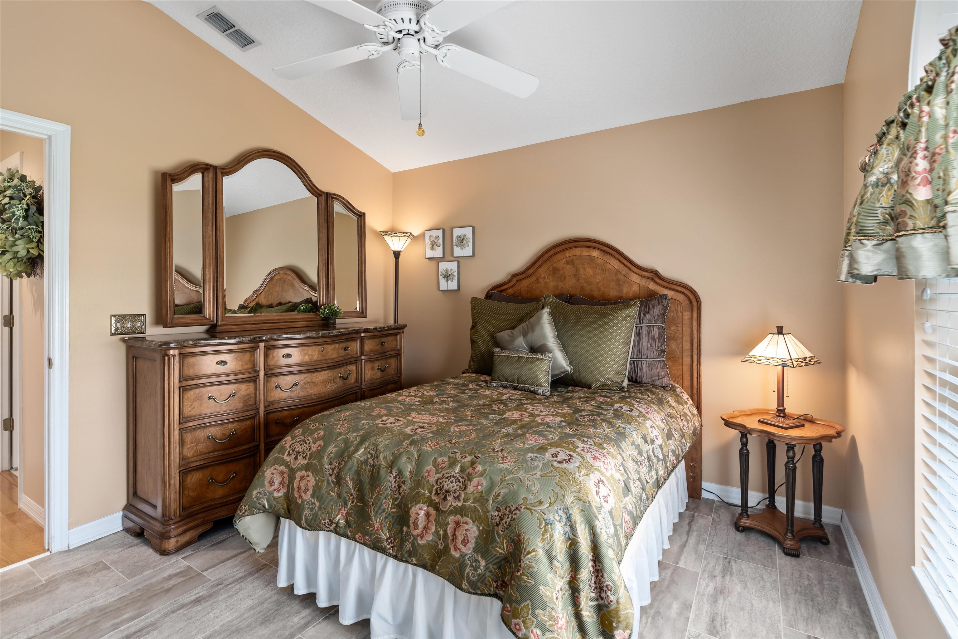 2325 Commodores Club Boulevard St. Augustine, FL 32080 - Photo 17 of 38 a bedroom with a bed and a mirror on the dresser